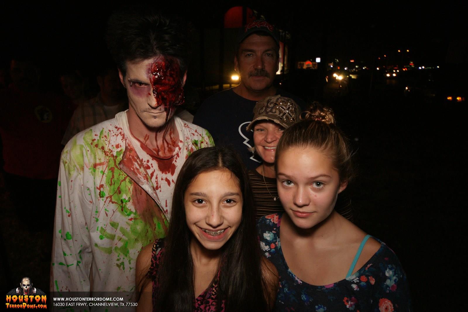Zombie photo bombs family photo. 