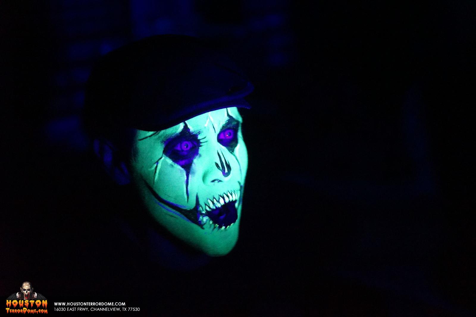 Ruben Galvan of Channel 2 KPRC face paint under black lights at Houston Terror Dome Haunted House