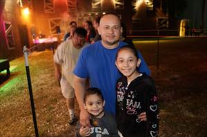 Family waiting in line at Haunted House.