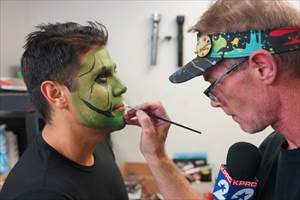 Ruben Galvan of Channel 2 KPRC getting his face painted at Terror Dome