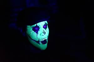 Ruben Galvan of Channel 2 KPRC face paint under black lights at Houston Terror Dome Haunted House