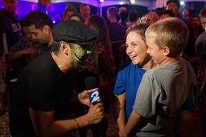 Ruben Galvan of Channel 2 KPRC asking boy if he is ready to experience the Haunt